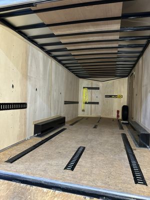 Interior of an enclosed trailer with tie-down rails